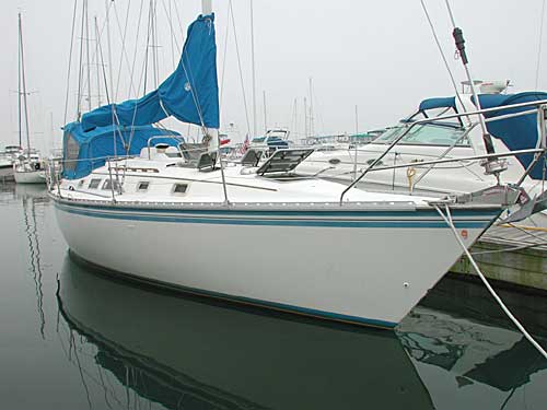 1984 Hunter 34 sailboat waiting at the dock ........